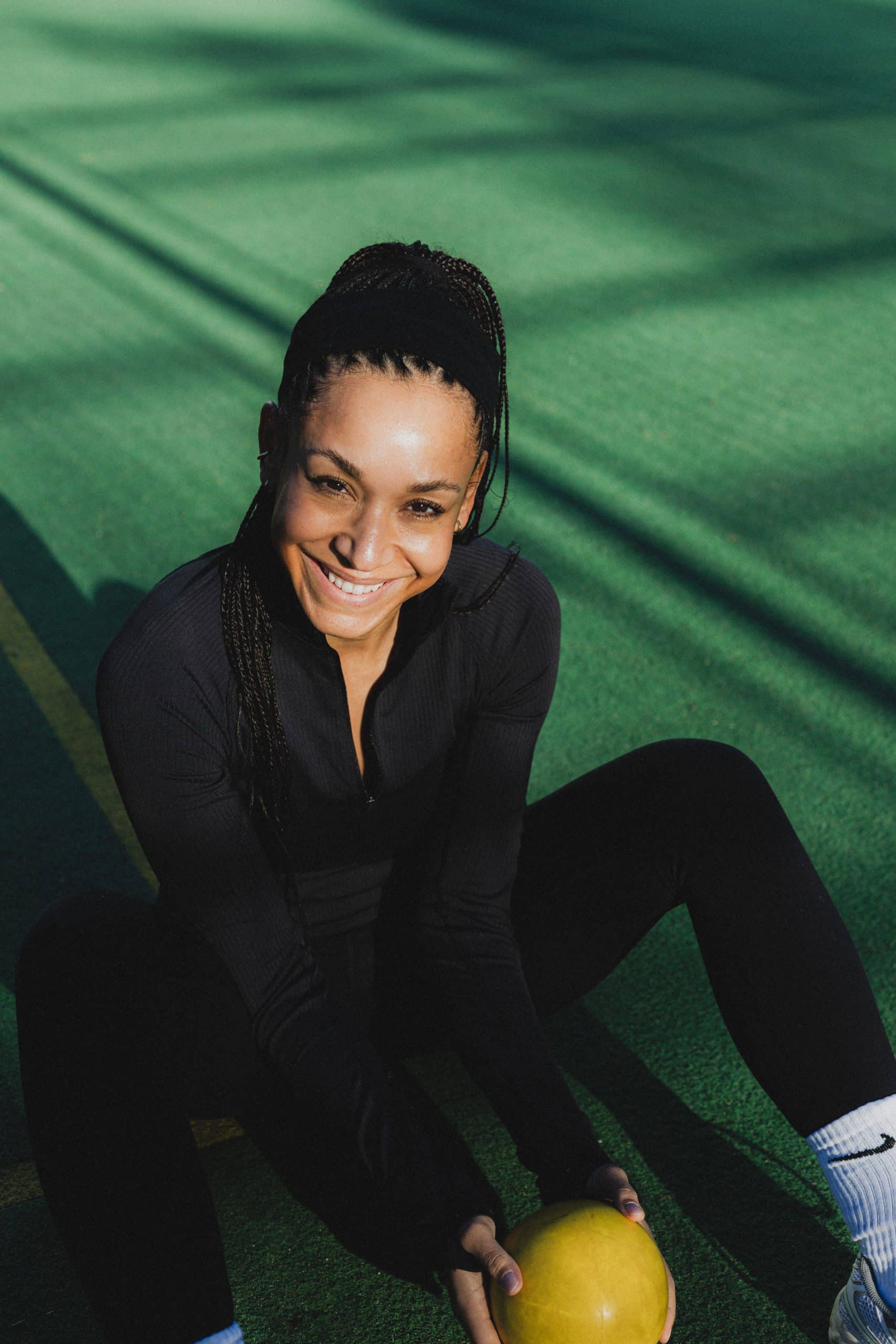 Portrait photoshoot woman green background sporty clothes