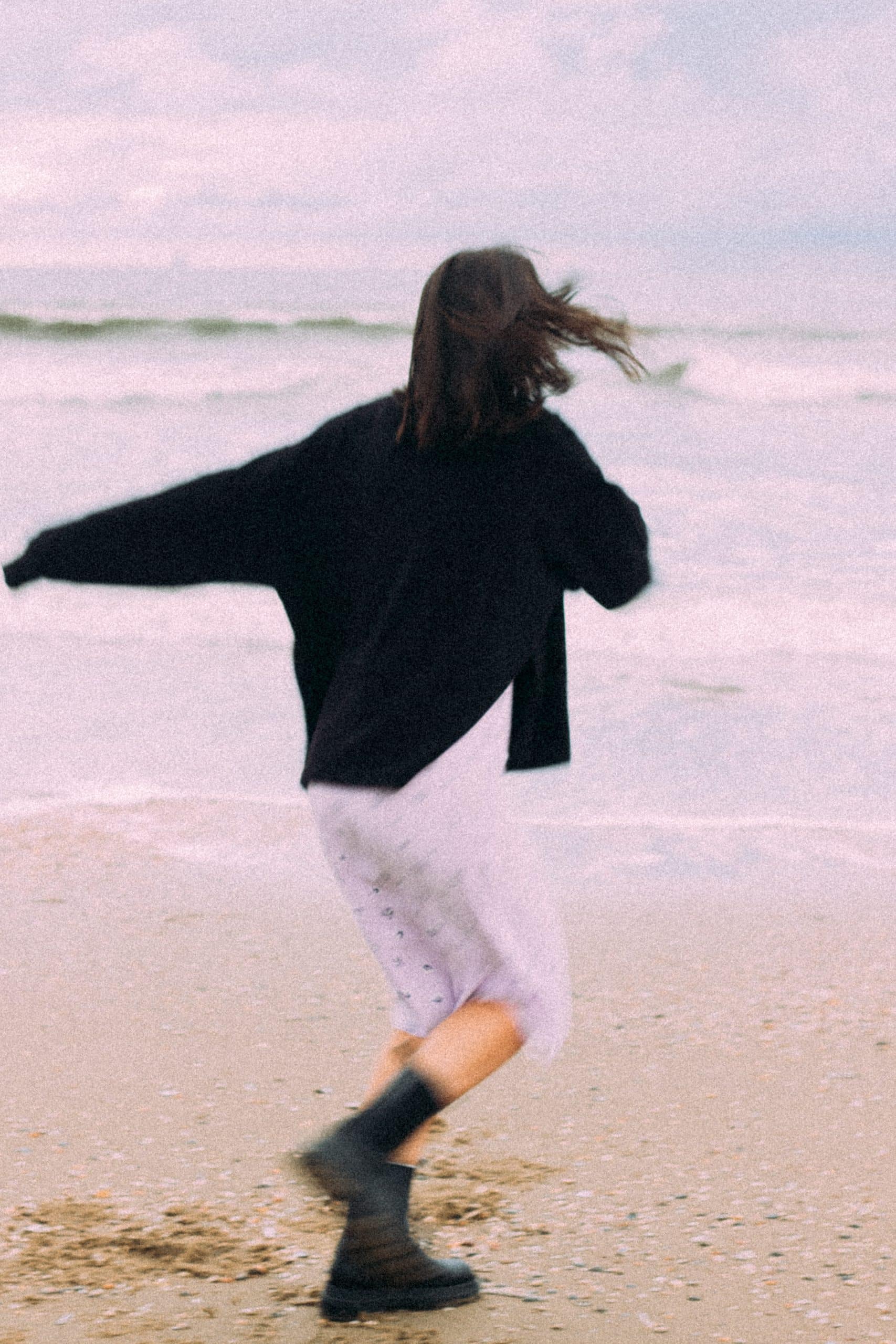 photo shoot by the sea netherlands woman moving