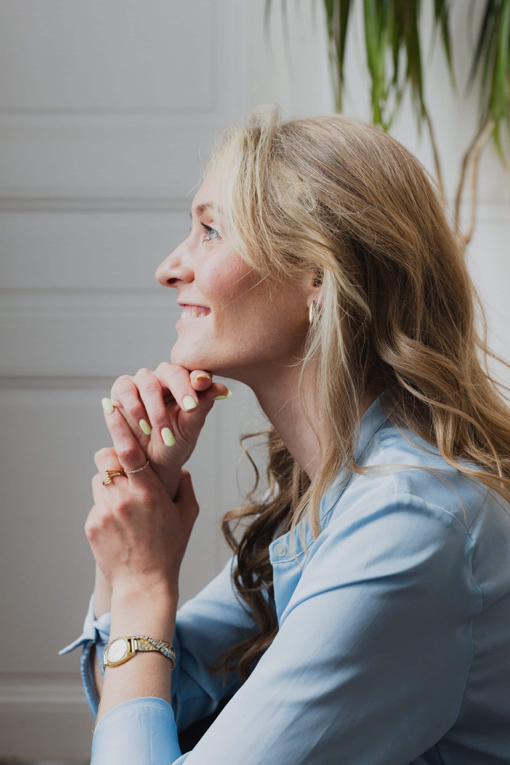 business woman portrait white background blue shirt