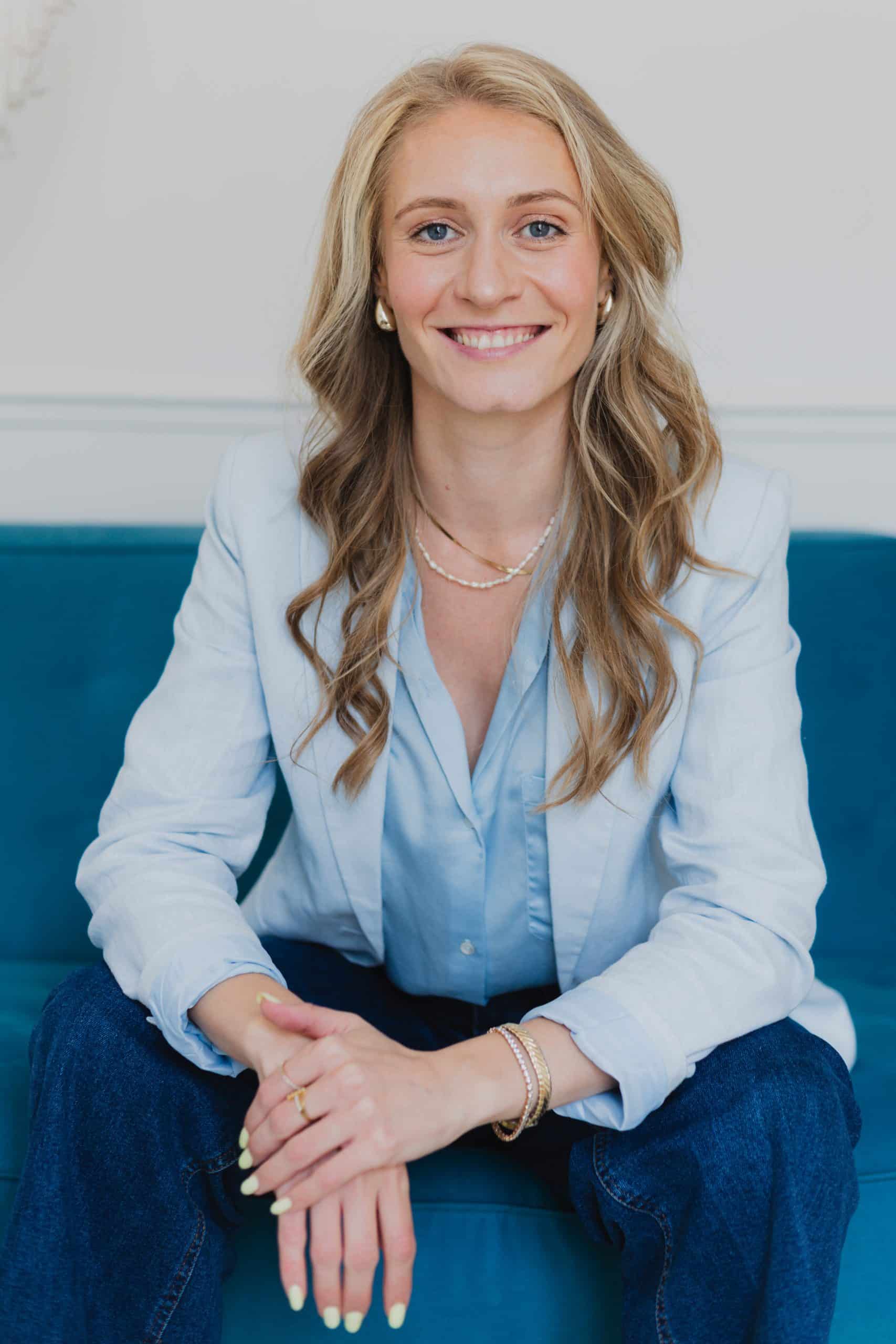 business woman portrait blue background blue shirt