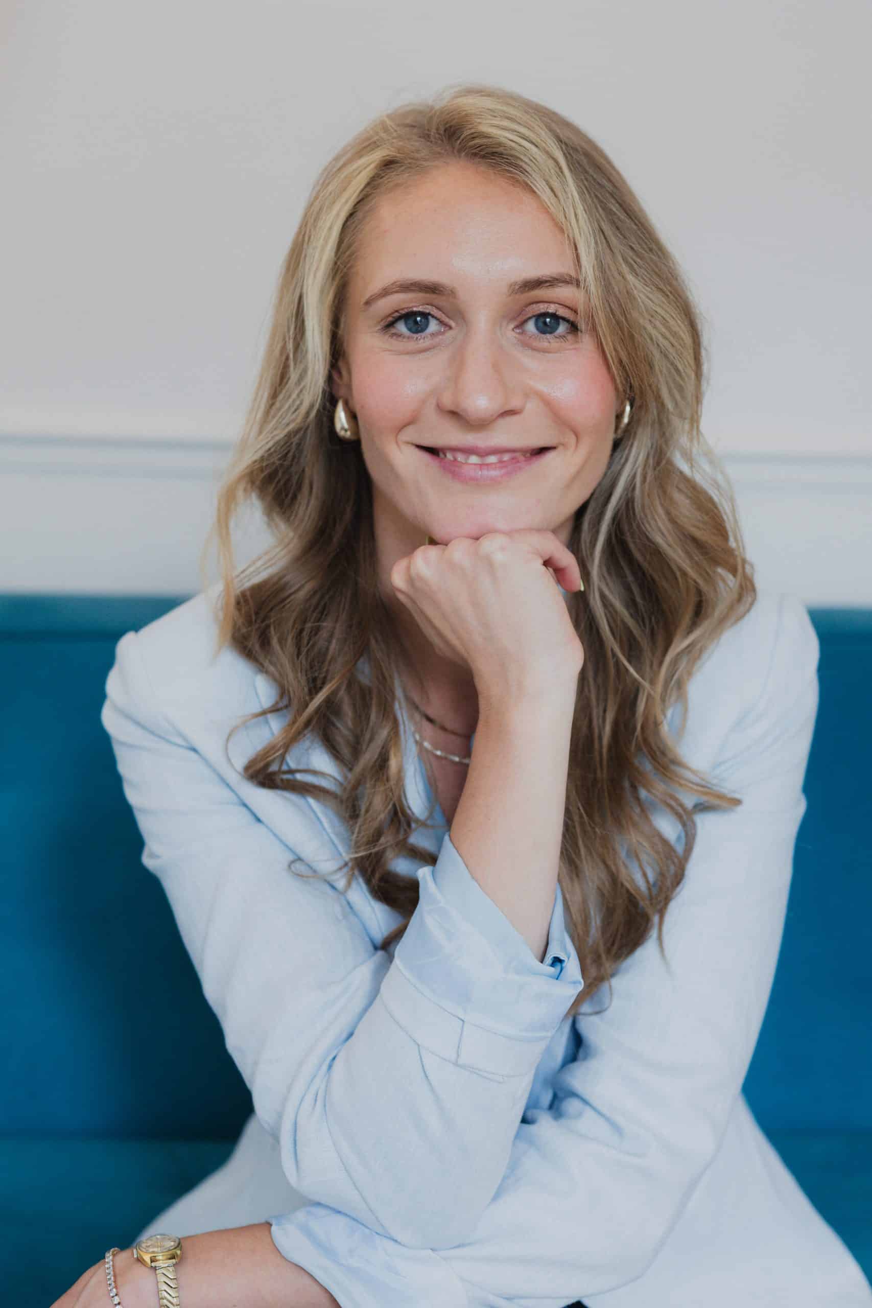 business woman portrait blue background blue shirt